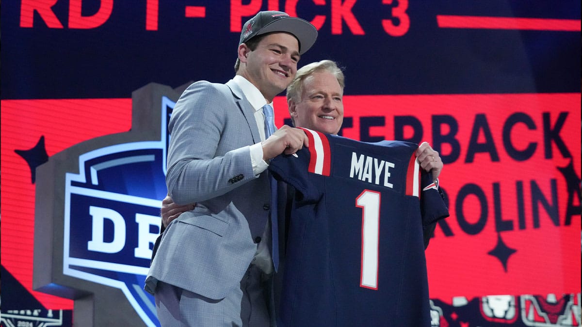 North Carolina Tar Heels quarterback Drake Maye poses with NFL commissioner Roger Goodell after being selected by the New England Patriots as the No. 3 pick in the first round of the 2024 NFL Draft at Campus Martius Park and Hart Plaza