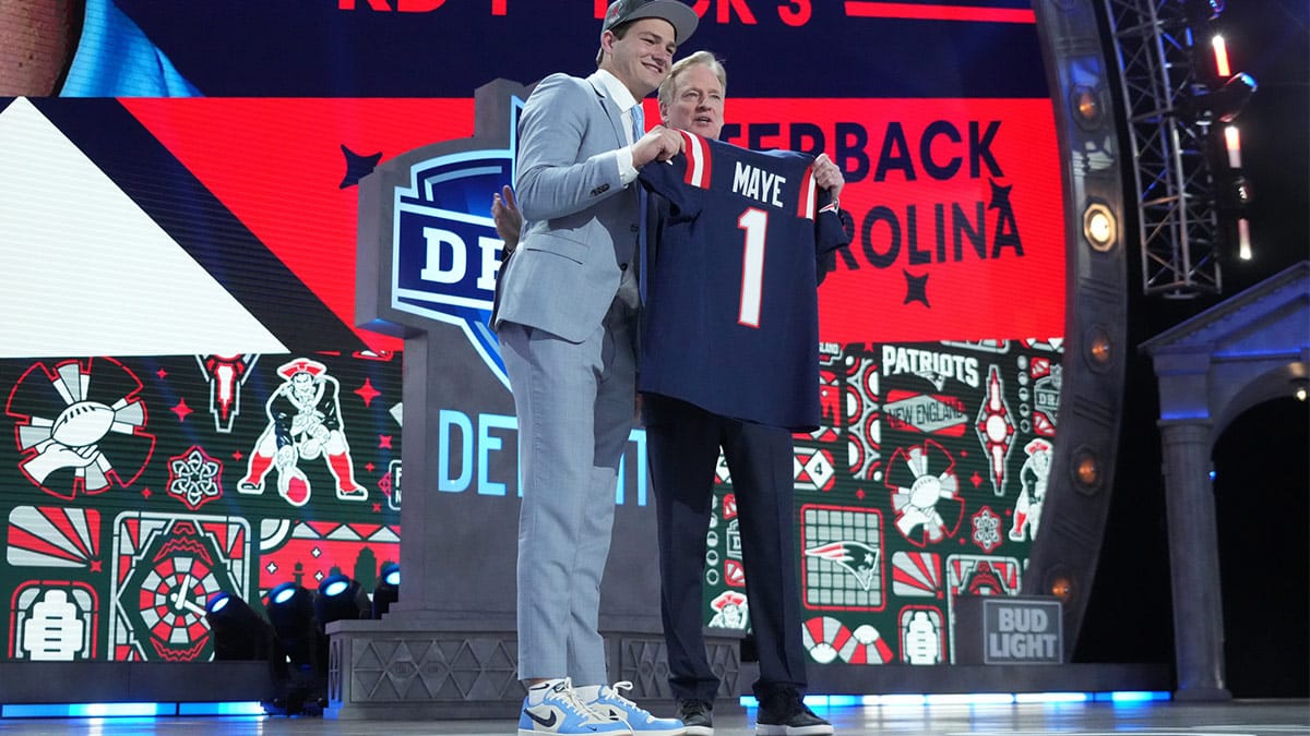 North Carolina Tar Heels quarterback Drake Maye poses with NFL commissioner Roger Goodell after being selected by the New England Patriots as the No. 3 pick in the first round of the 2024 NFL Draft