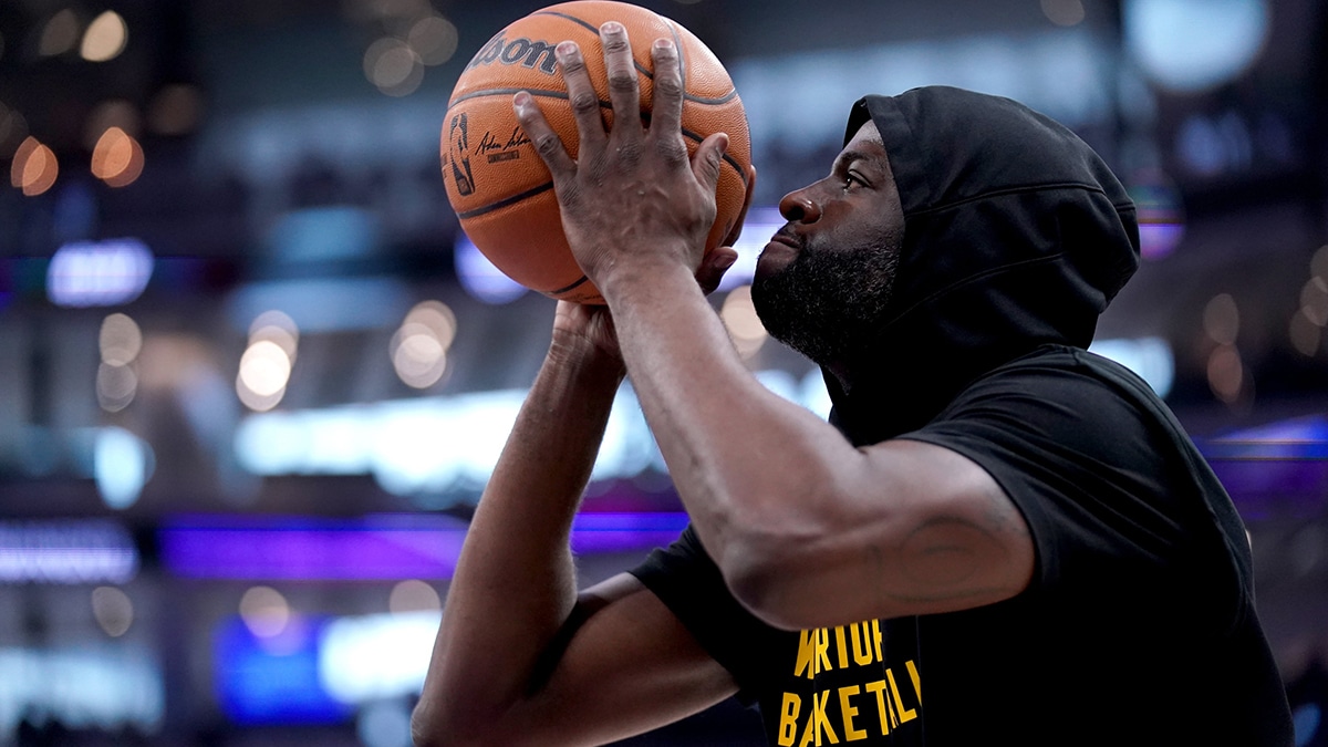 Golden State Warriors forward Draymond Green (23) shoots before a game against the Sacramento Kings in a play-in game of the 2024 NBA playoffs at the Golden 1 Center.