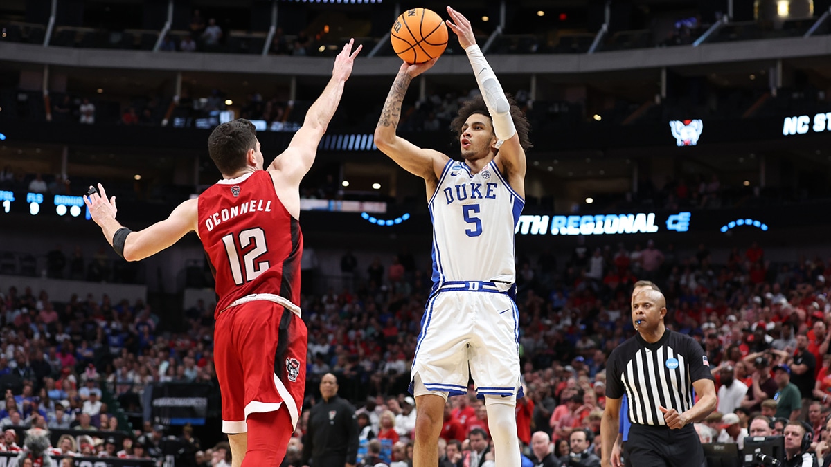 Mar 31, 2024; Dallas, TX, USA; Duke Blue Devils guard Tyrese Proctor (5) shoots against North Carolina State Wolfpack guard Michael O'Connell (12) in the second half in the finals of the South Regional of the 2024 NCAA Tournament at American Airline Center. Mandatory Credit: Tim Heitman-USA TODAY Sports