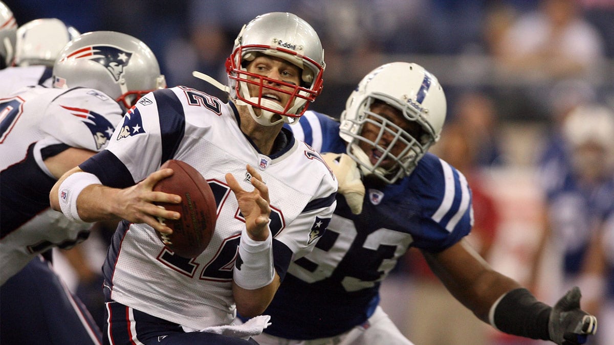 Indianapolis Colts defensive end Dwight Freeney (93) pressures New England Patriots quarterback Tom Brady (12) during the 3rd quarter of the AFC Championship game at the RCA Dome in Indianapolis, IN.