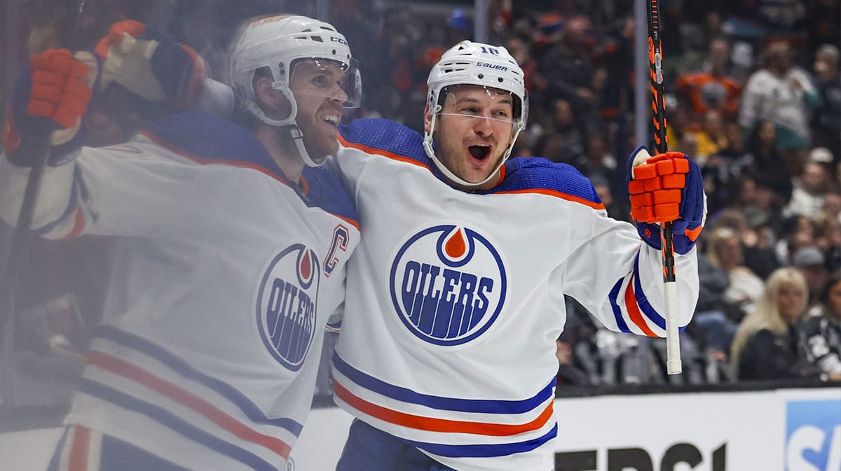 Edmonton Oilers left wing Zach Hyman (18), right, celebrates with Edmonton Oilers Connor McDavid (97), left, after McDavid scored a goal against the Los Angeles Kings in the first period of game three of the first round of the 2024 Stanley Cup Playoffs at Crypto.com Arena.