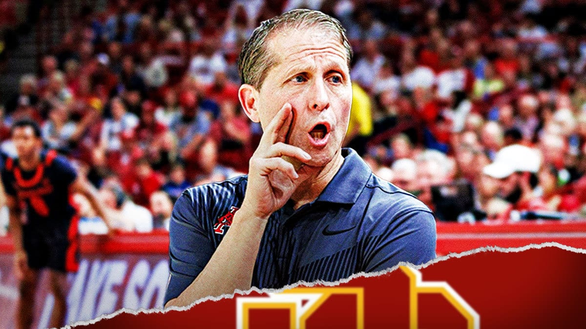 Arkansas coach Eric Musselman stands next to USC logo, Bronny James in background
