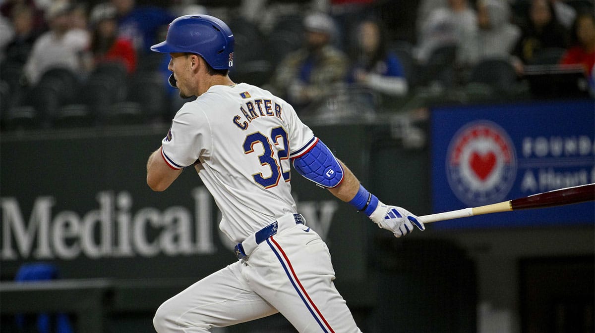 Texas Rangers left fielder Evan Carter (32) hits a double against the Oakland Athletics during the first inning at Globe Life Field.