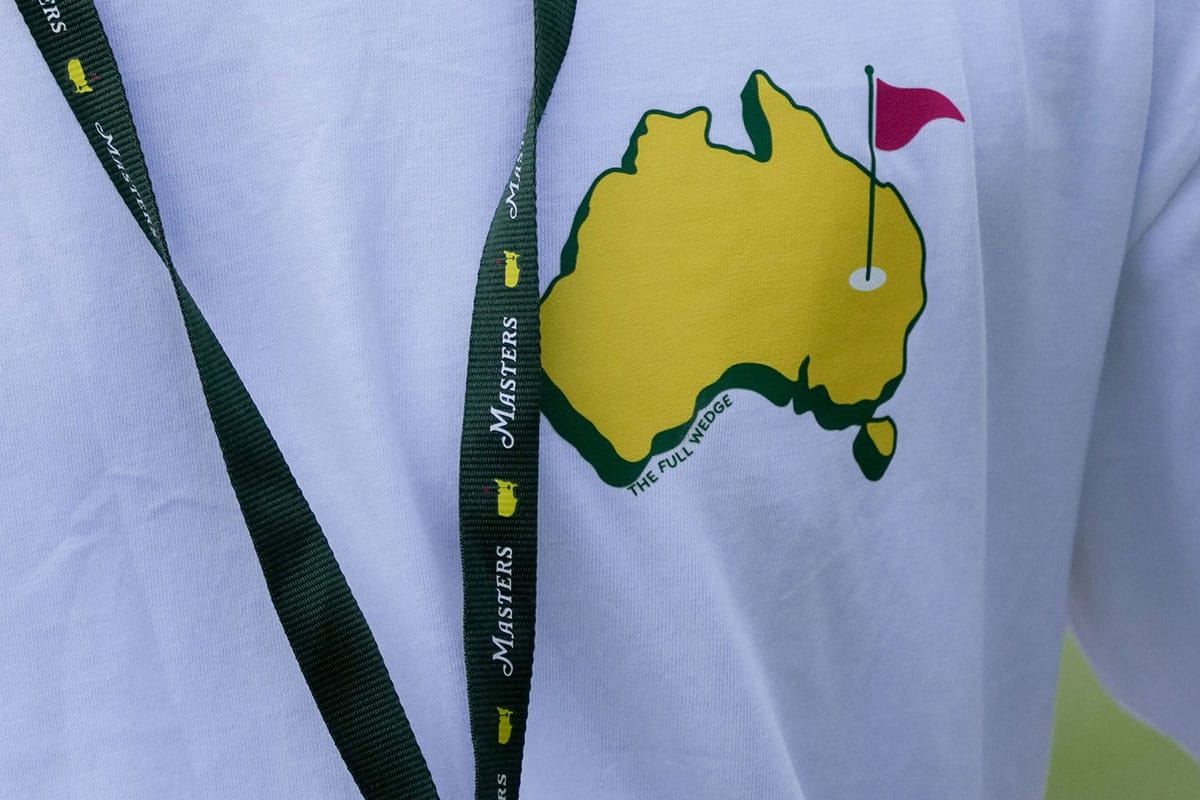 A patron wears a shirt with a logo depicting Australia as the Masters logo during the Par 3 Contest at Augusta National Golf Club. 