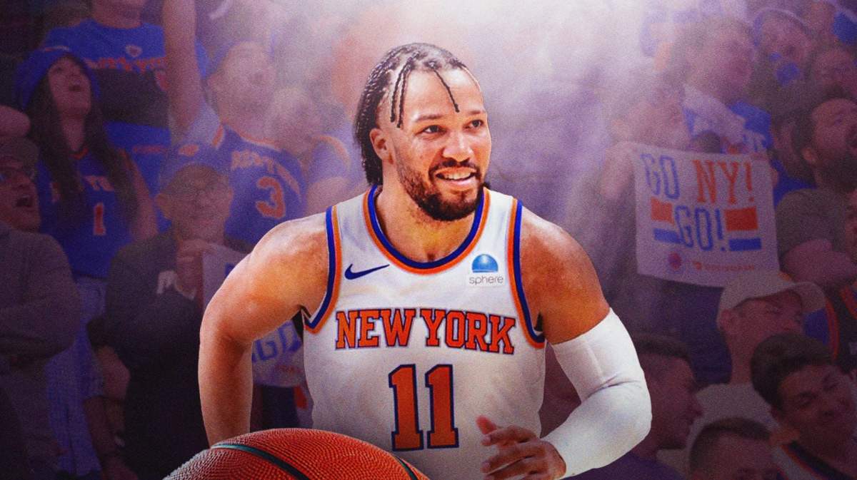 Knicks guard Jalen Brunson, with Knicks fans in the background cheering.