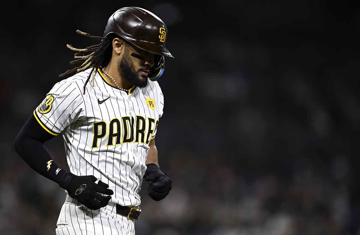 San Diego Padres right fielder Fernando Tatis Jr. (23) advances to first base after a walk during the sixth inning against the Chicago Cubs at Petco Park.