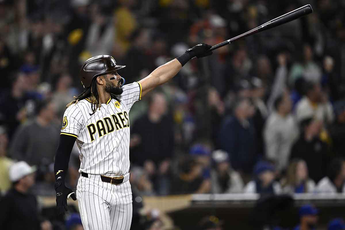 San Diego Padres right fielder Fernando Tatis Jr. (23) hits a two-run home run against the Chicago Cubs during the eighth inning at Petco Park.