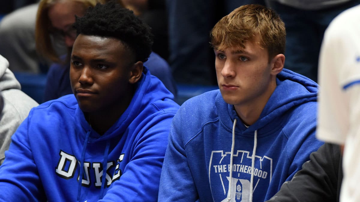 Duke Blue Devils commits Patrick Ngongba (left) and Cooper Flagg look on prior to a game against the North Carolina Tar Heels at Cameron Indoor Stadium.