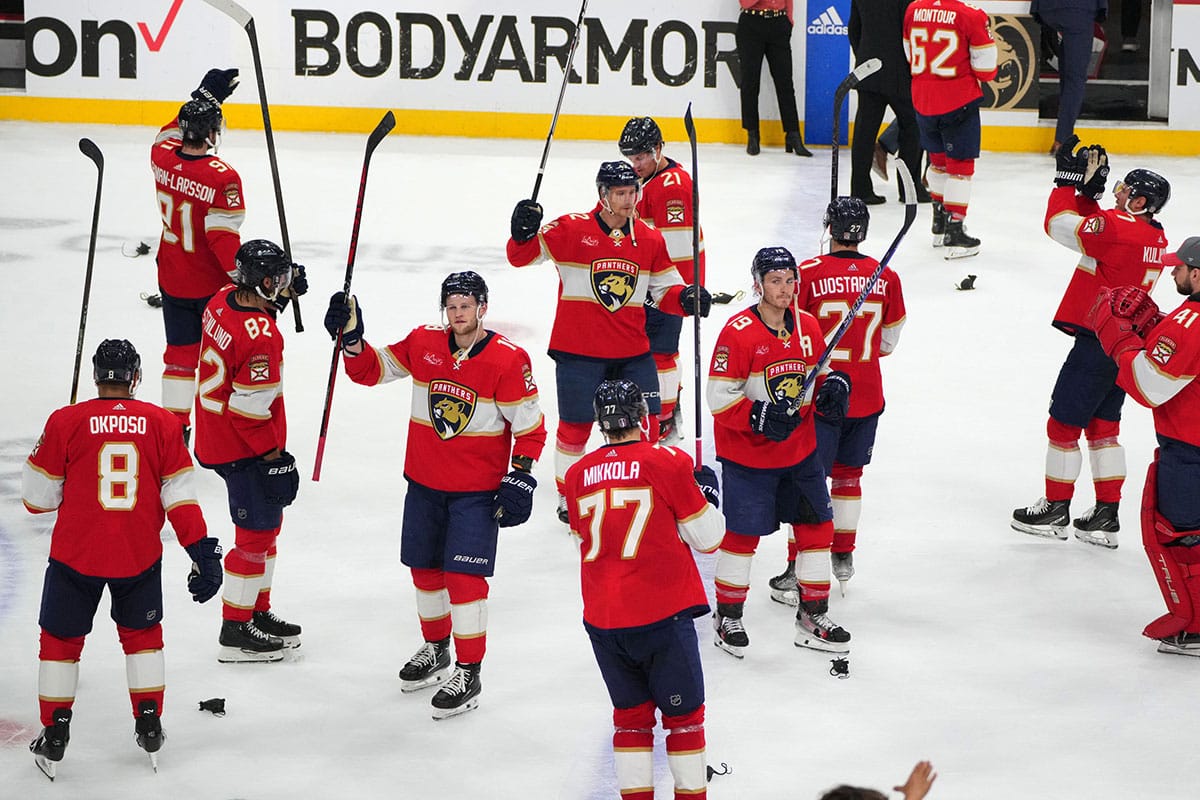 Florida Panthers celebrate advancing to the second round of the 2024 Stanley Cup Playoffs with fans following a victory over the Tampa Bay Lightning at Amerant Bank Arena.