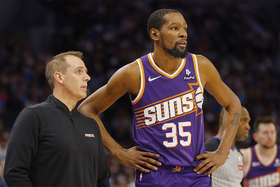 Phoenix Suns head coach Frank Vogel speaks with forward Kevin Durant (35) during a free throw by the Minnesota Timberwolves in the third quarter at Target Center.