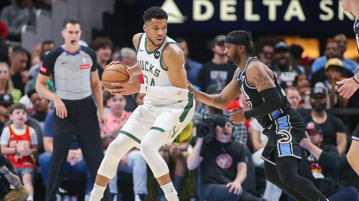  Milwaukee Bucks forward Giannis Antetokounmpo (34) is defended by Atlanta Hawks guard Wesley Matthews (32) in the second half at State Farm Arena.