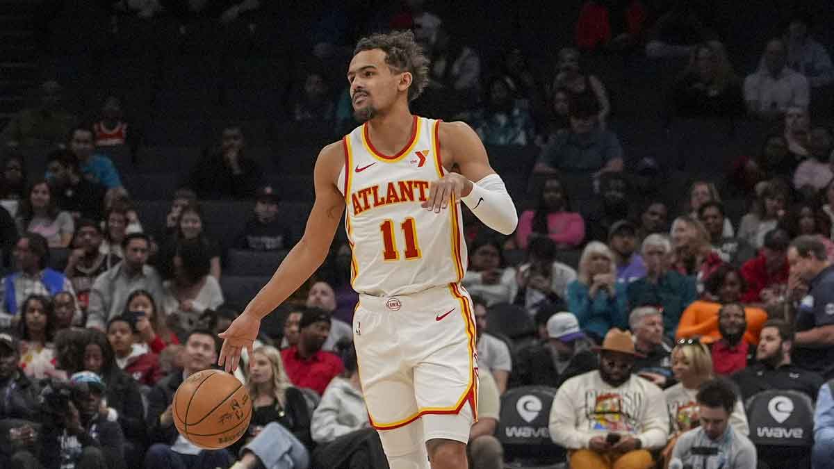 Atlanta Hawks guard Trae Young (11) handles the ball against the Charlotte Hornets during the first quarter at Spectrum Center