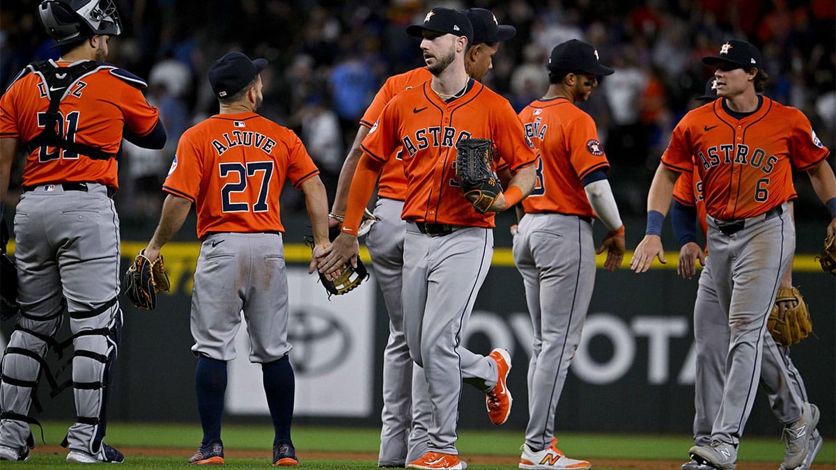 Houston Astros catcher Yainer Diaz (21) and second baseman Jose Altuve (27) and right fielder Kyle Tucker (30) and shortstop Jeremy Pena (3) and center fielder Jake Meyers (6) celebrate after the Astros defeat the Texas Rangers at Globe Life Field