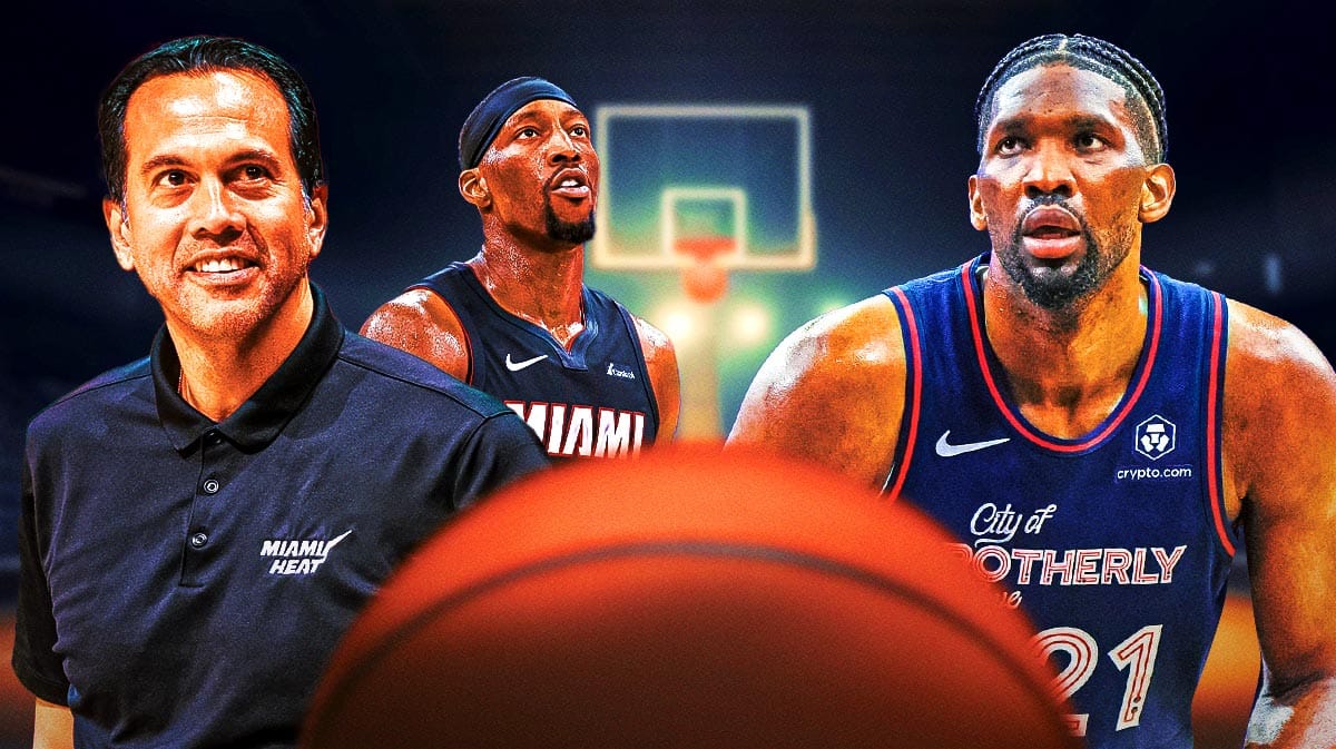 Miami Heat head coach Erik Spoelstra and star Bam Adebayo looking at Philadelphia 76ers star Joel Embiid in front of the Kaseya Center.