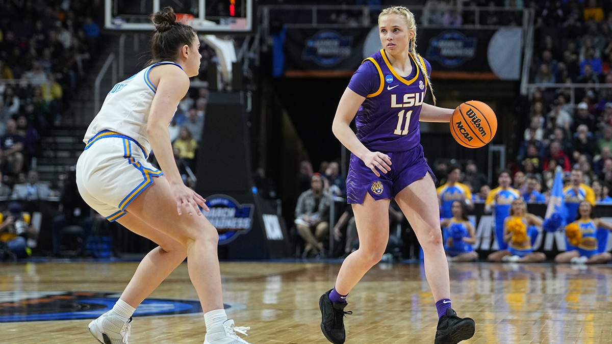 LSU Tigers guard Hailey Van Lith (11) dribbles the ball against UCLA Bruins guard Camryn Brown (35) during the second half in the semifinals of the Albany Regional of the 2024 NCAA Tournament at MVP Arena.