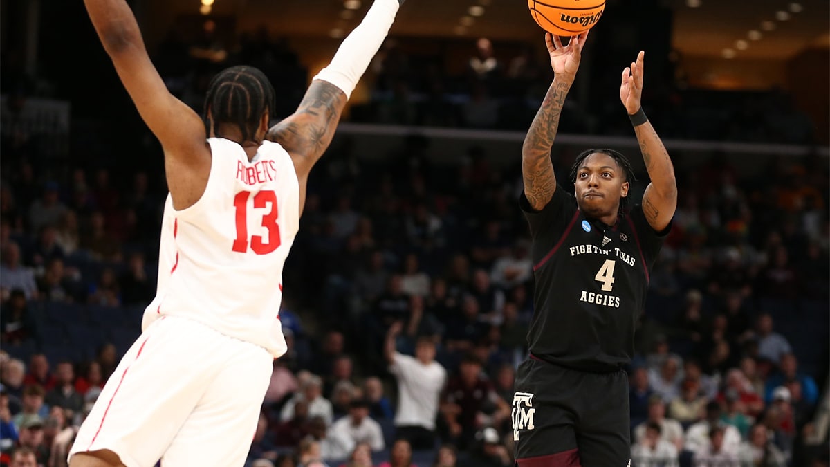 Texas A&M Aggies guard Wade Taylor IV (4) shoots against Houston Cougars forward J'Wan Roberts (13) in the second half in the second round of the 2024 NCAA Tournament at FedExForum.