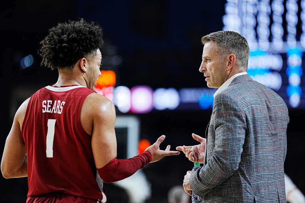 Alabama guard Mark Sears (1) talks with head coach Nate Oats during the Final Four semifinal game against Connecticut at State Farm Stadium.