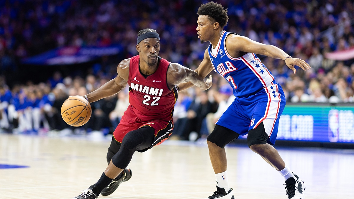Miami Heat forward Jimmy Butler (22) dribbles the ball past Philadelphia 76ers guard Kyle Lowry (7) during the second quarter of a play-in game of the 2024 NBA playoffs at Wells Fargo Center. 