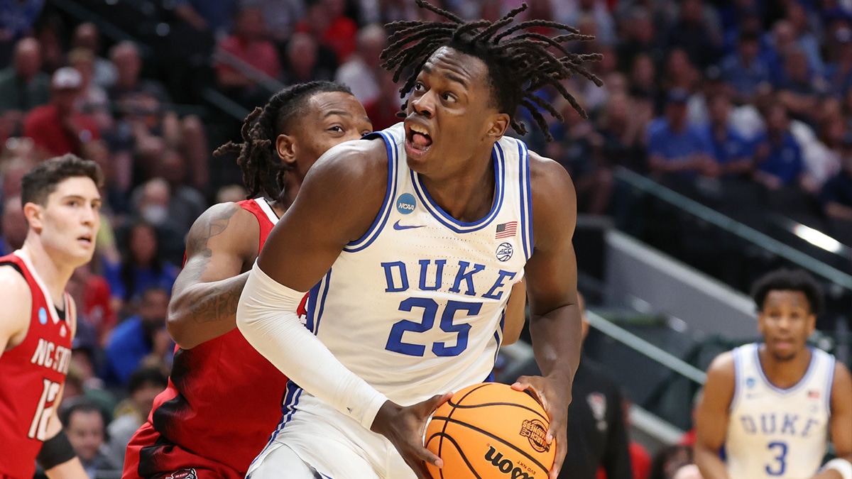 Duke Blue Devils forward Mark Mitchell (25) controls the ball against North Carolina State Wolfpack guard DJ Horne (0) in the first half in the finals of the South Regional of the 2024 NCAA Tournament at American Airline Center.