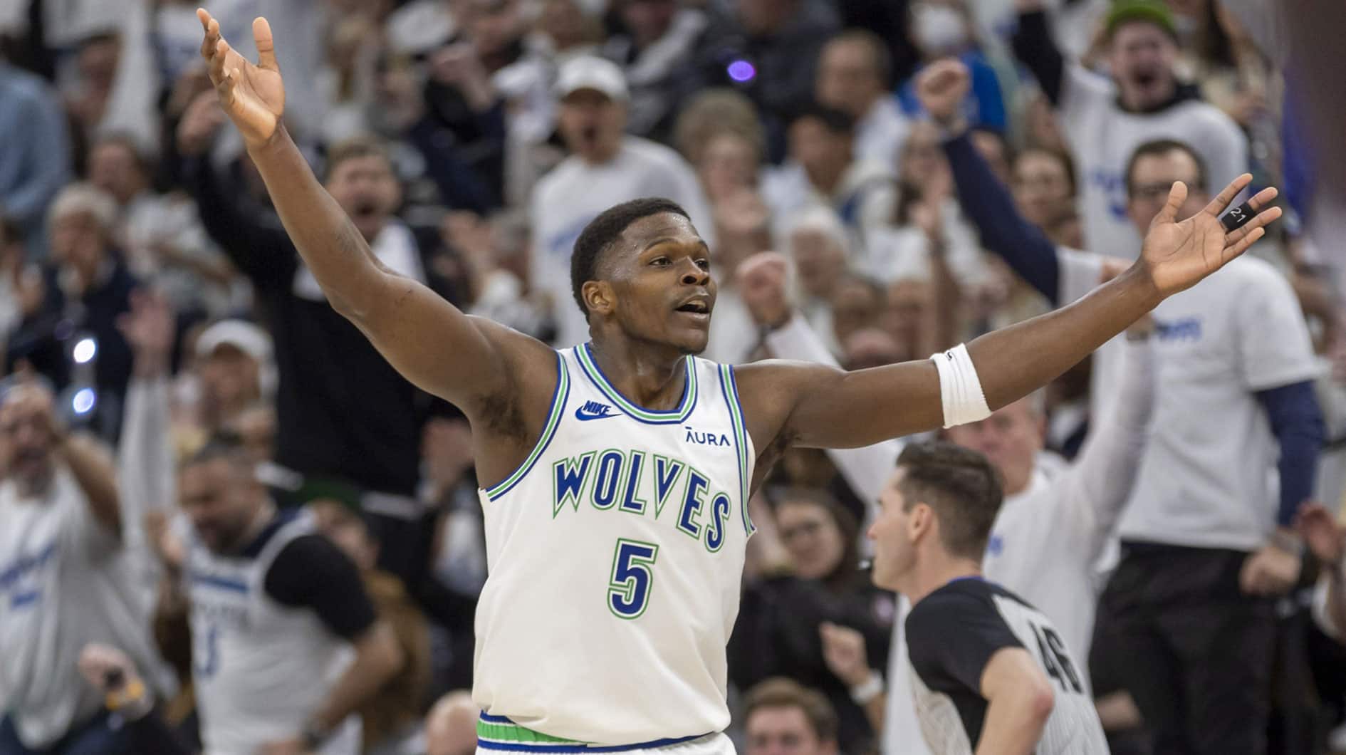Minnesota Timberwolves guard Anthony Edwards (5) reacts after making a three point shot against the Phoenix Suns in the second half during game one of the first round for the 2024 NBA playoffs at Target Center.