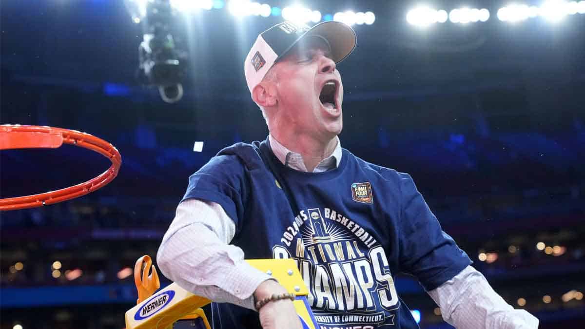Connecticut Huskies head coach Dan Hurley cuts down the cut after defeating the Purdue Boilermakers in the national championship game of the Final Four of the 2024 NCAA Tournament at State Farm Stadium in Glendale on April 8, 2024.