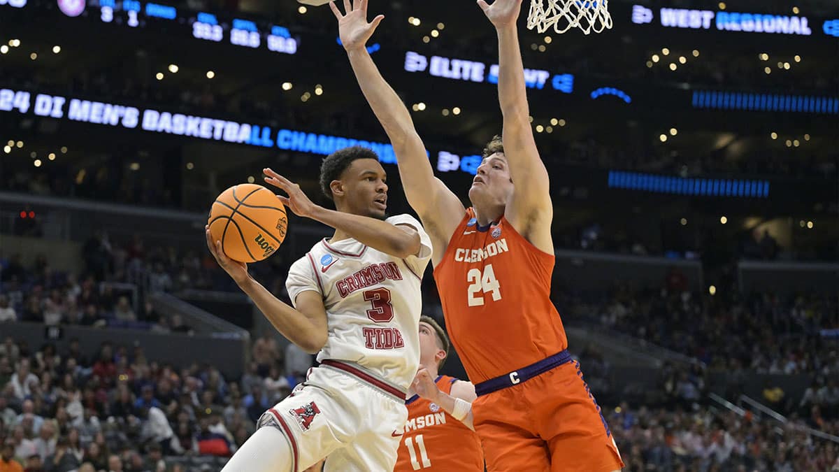 Alabama Crimson Tide guard Rylan Griffen (3) controls the ball against Clemson Tigers center PJ Hall (24) in the second half in the finals of the West Regional of the 2024 NCAA Tournament at Crypto.com Arena.
