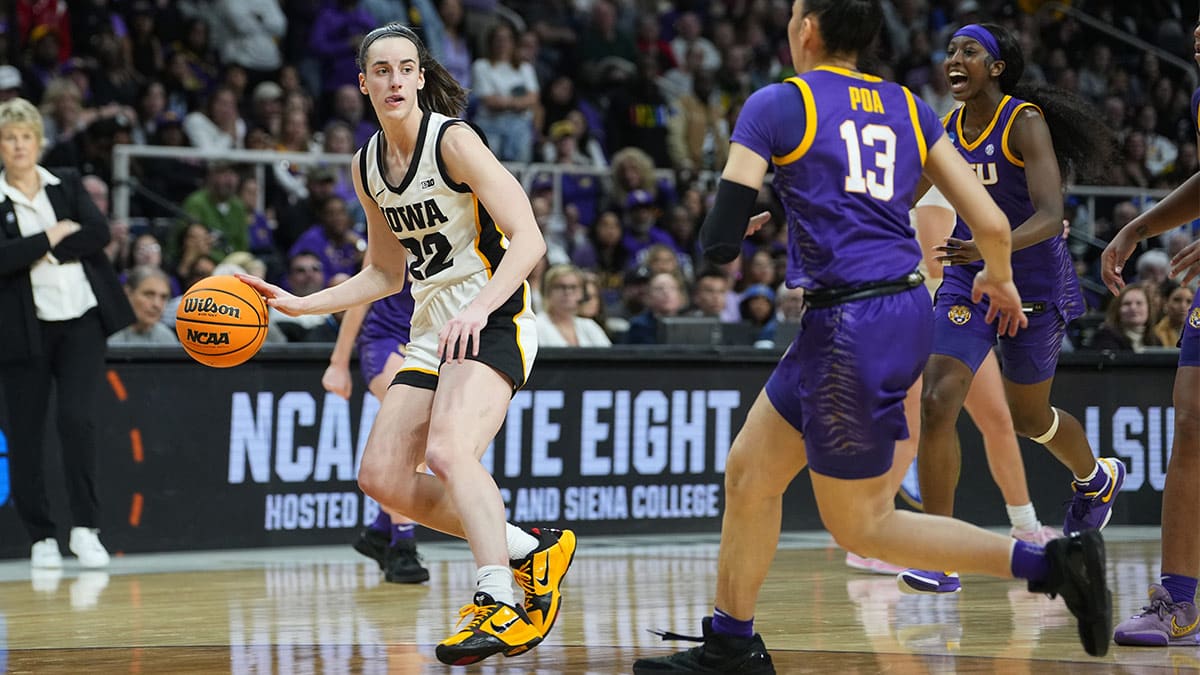 Iowa Hawkeyes guard Caitlin Clark (22) controls the ball against LSU Lady Tigers guard Last-Tear Poa (13) in the fourth quarter in the finals of the Albany Regional in the 2024 NCAA Tournament at MVP Arena
