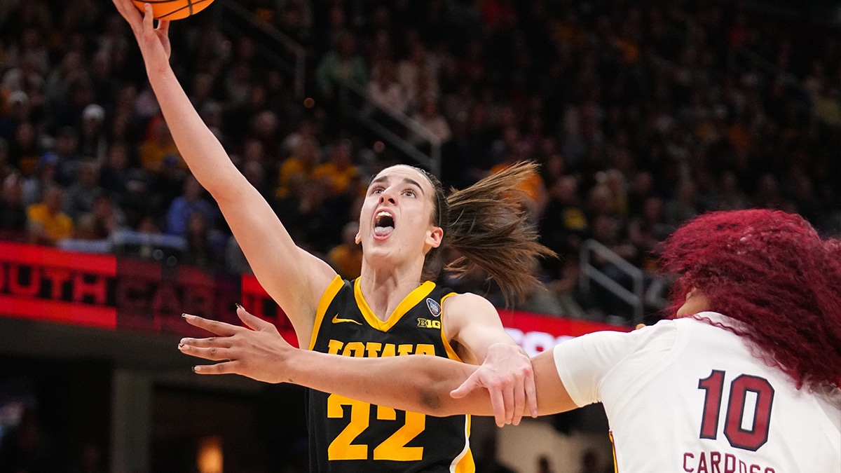 Iowa Hawkeyes guard Caitlin Clark (22) drives to the basket as South Carolina Gamecocks center Kamilla Cardoso (10) defends during the NCAA Tournament championship basketball game at Rocket Mortgage Fieldhouse, Sunday, April 7, 2024 in Cleveland.