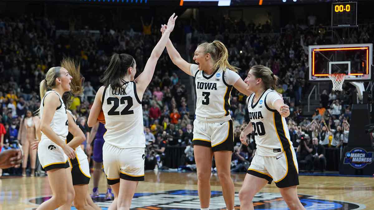 Apr 1, 2024; Albany, NY, USA; Iowa Hawkeyes guard Caitlin Clark (22) celebrates with teammates after defeating the LSU Lady Tigers in the finals of the Albany Regional in the 2024 NCAA Tournament at MVP Arena. Mandatory Credit: Gregory Fisher-USA TODAY Sports