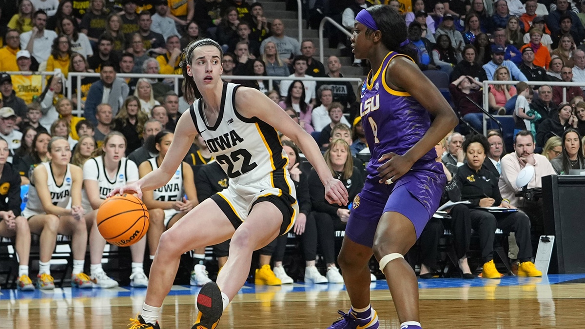 Iowa Hawkeyes guard Caitlin Clark (22) controls the ball against LSU Lady Tigers guard Flau'jae Johnson (4) in the third quarter in the finals of the Albany Regional in the 2024 NCAA Tournament