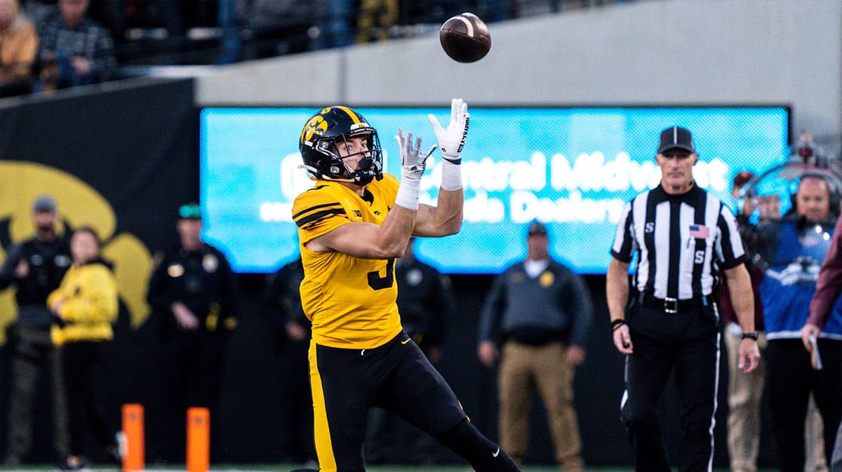 Iowa defensive back Cooper DeJean (3) catches a punt at Kinnick Stadium on Saturday, October 21, 2023 in Iowa City. DeJean returned the punt for a touchdown and it was later called back after review ruled he fair-caught the punt.