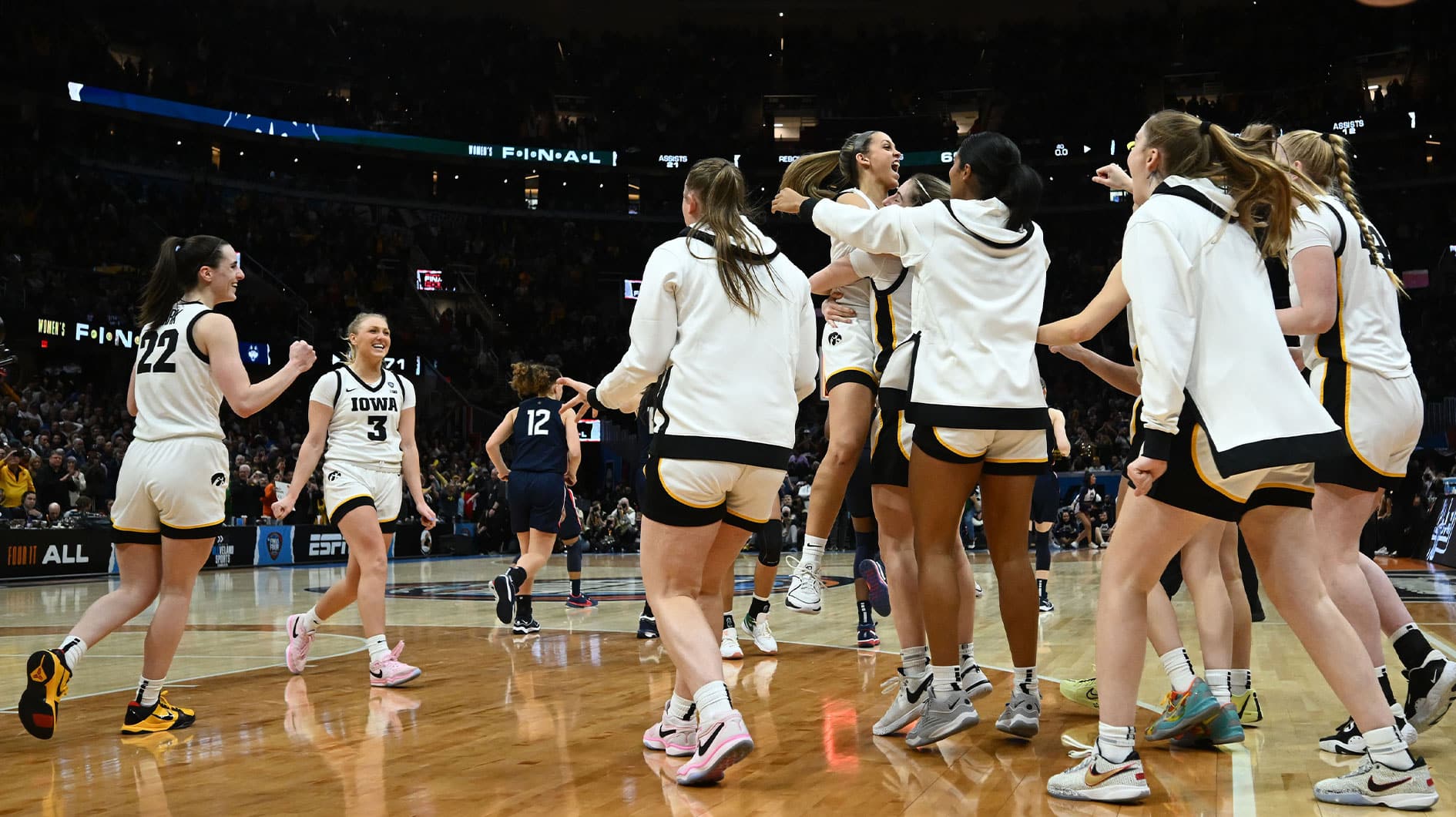 The Iowa Hawkeyes bench reacts after defeating the Connecticut Huskies in the semifinals of the Final Four of the womens 2024 NCAA Tournament at Rocket Mortgage FieldHouse