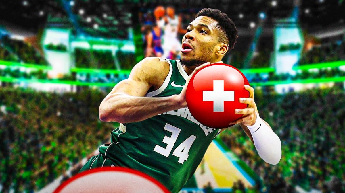 Giannis Antetokounmpo (Bucks) shooting a ball that has medical cross symbol