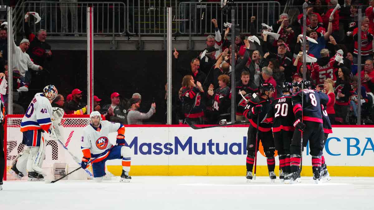  Carolina Hurricanes left wing Teuvo Teravainen (86) celebrates his goal with center Sebastian Aho (20), center Seth Jarvis (24) and defenseman Brent Burns (8) against the New York Islanders during the second period in game two of the first round of the 2024 Stanley Cup Playoffs at PNC Arena.