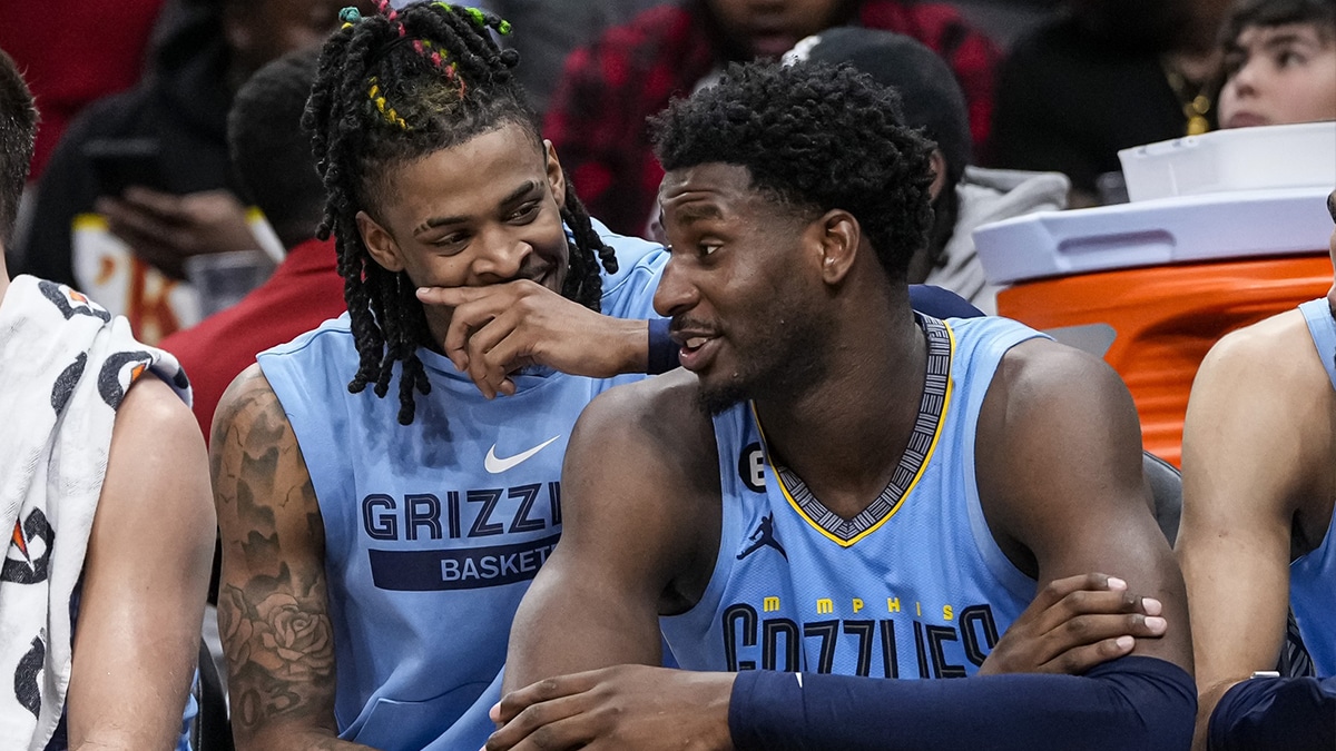 Memphis Grizzlies guard Ja Morant (12) and forward Jaren Jackson Jr. (13) react ons the bench during the game against the Atlanta Hawks during the second half at State Farm Arena