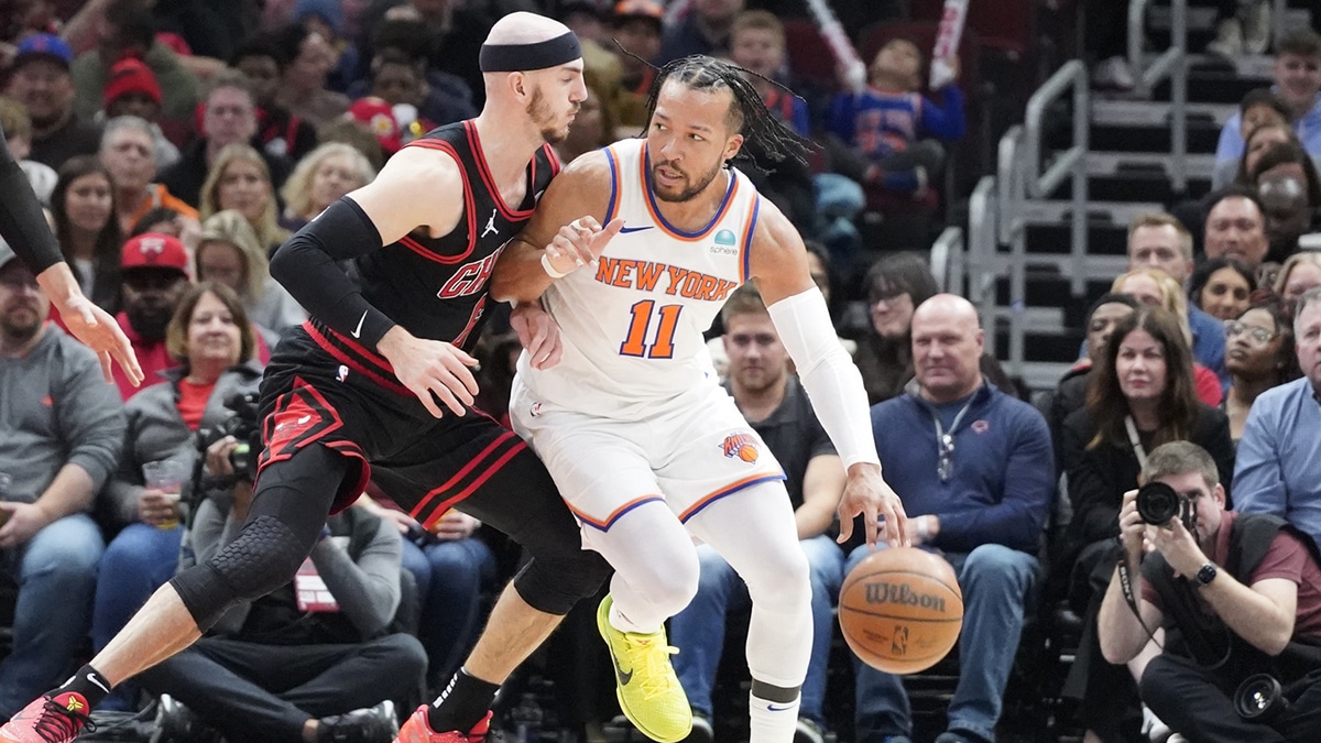 Chicago Bulls guard Alex Caruso (6) defends New York Knicks guard Jalen Brunson (11) during the first quarter at United Center. 