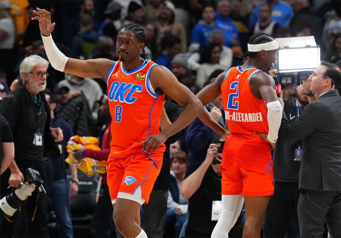 Oklahoma City Thunder forward Jalen Williams (8) and guard Shai Gilgeous-Alexander (2) celebrate after defeating the Denver Nuggets at Ball Arena