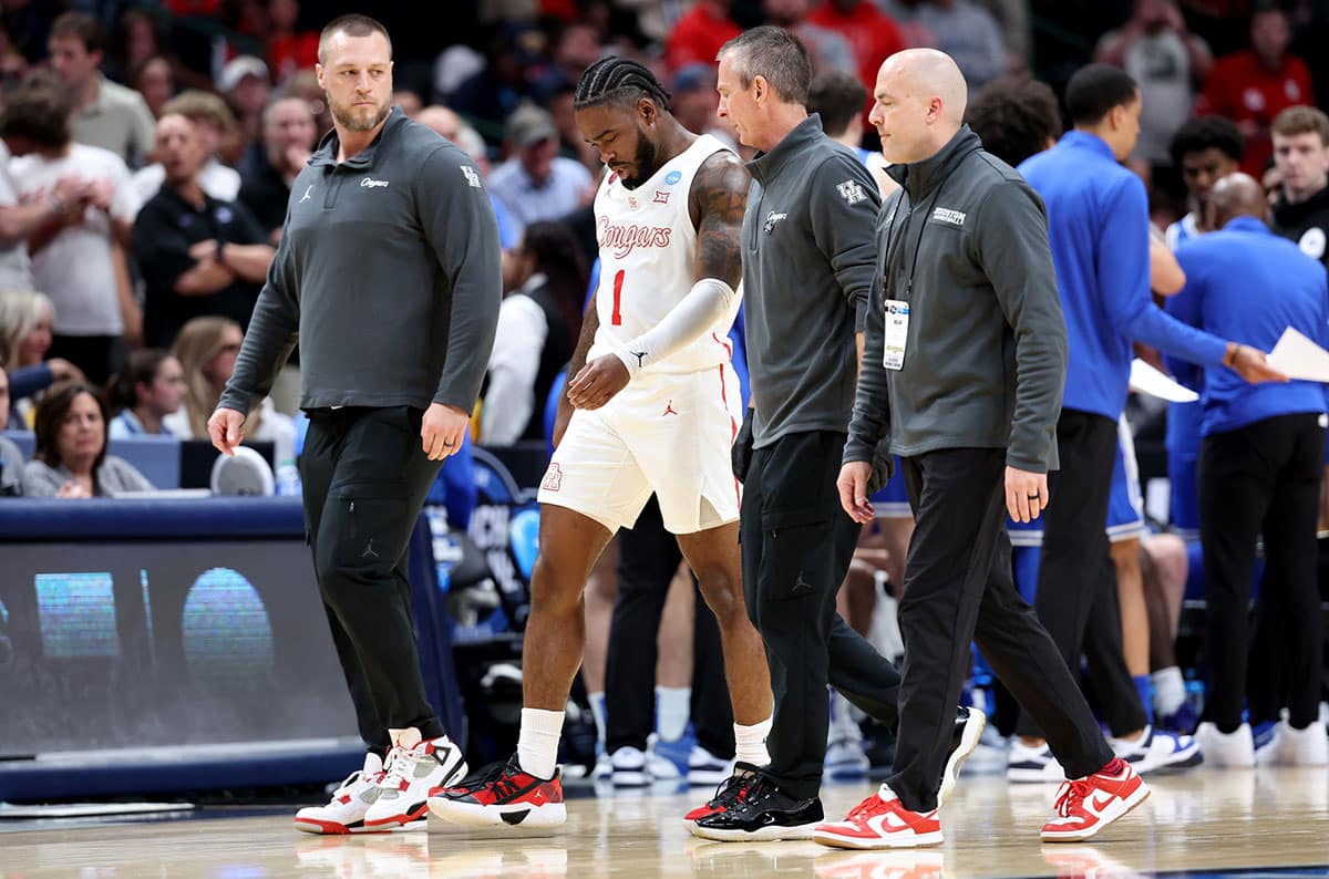 Houston Cougars guard Jamal Shead (1) walks off the floor after an injury during the first half in the semifinals of the South Regional of the 2024 NCAA Tournament against the Duke Blue Devils at American Airlines Center.