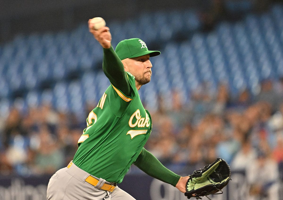 Oakland Athletics starting pitcher James Kaprielian (32) delivers a pitch against the Toronto Blue Jays in the first inning at Rogers Centre.