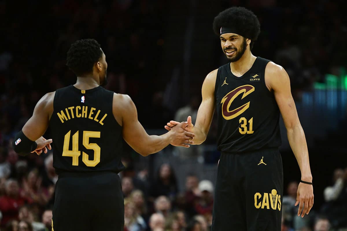 Cleveland Cavaliers guard Donovan Mitchell (45) and center Jarrett Allen (31) celebrate during the second half against the Memphis Grizzlies at Rocket Mortgage FieldHouse.