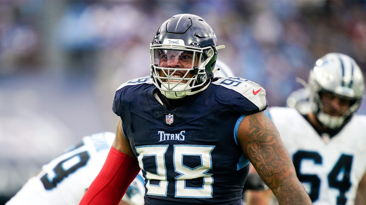 Tennessee Titans defensive tackle Jeffery Simmons (98) celebrates sacking Carolina Panthers quarterback Bryce Young during the third quarter at Nissan Stadium in Nashville, Tenn