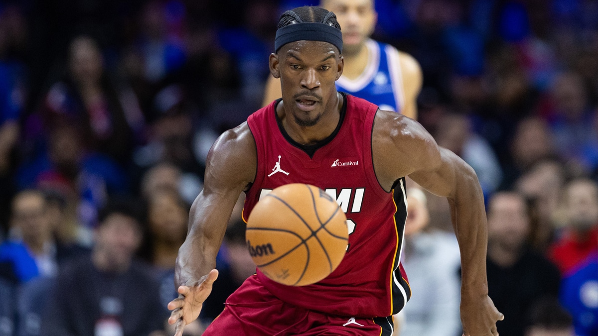 Miami Heat forward Jimmy Butler (22) picks up a loose ball against the Philadelphia 76ers during the second quarter of a play-in game of the 2024 NBA playoffs at Wells Fargo Center.