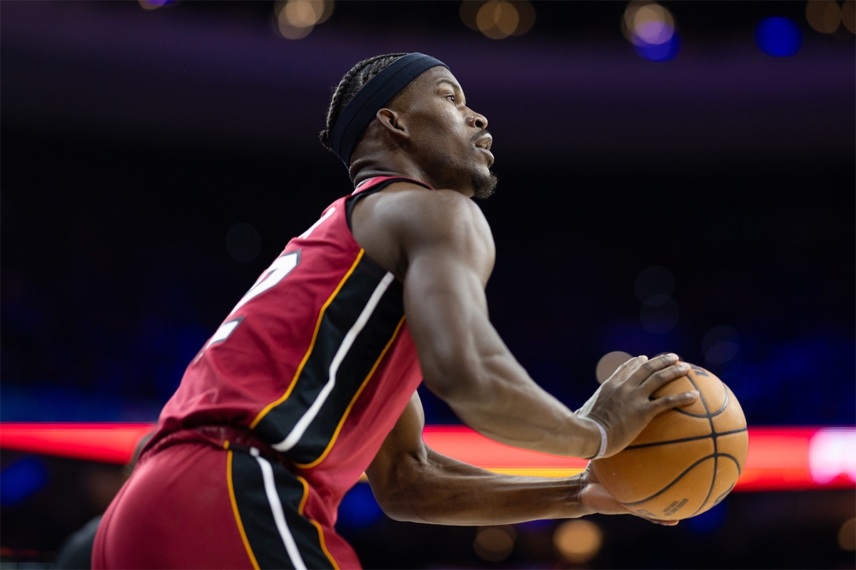  Miami Heat forward Jimmy Butler (22) lines up a shot against the Philadelphia 76ers during the first quarter of a play-in game of the 2024 NBA playoffs at Wells Fargo Center.