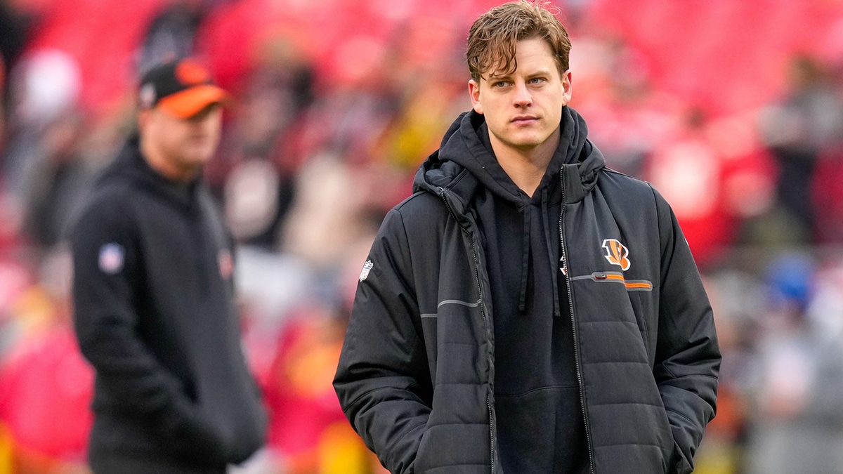 Injured Cincinnati Bengals quarterback Joe Burrow (9) walks the field before the first quarter of the NFL Week 17 game between the Kansas City Chiefs and the Cincinnati Bengals at Arrowhead Stadium in Kansas City, Mo., on Sunday, Dec. 31, 2023.