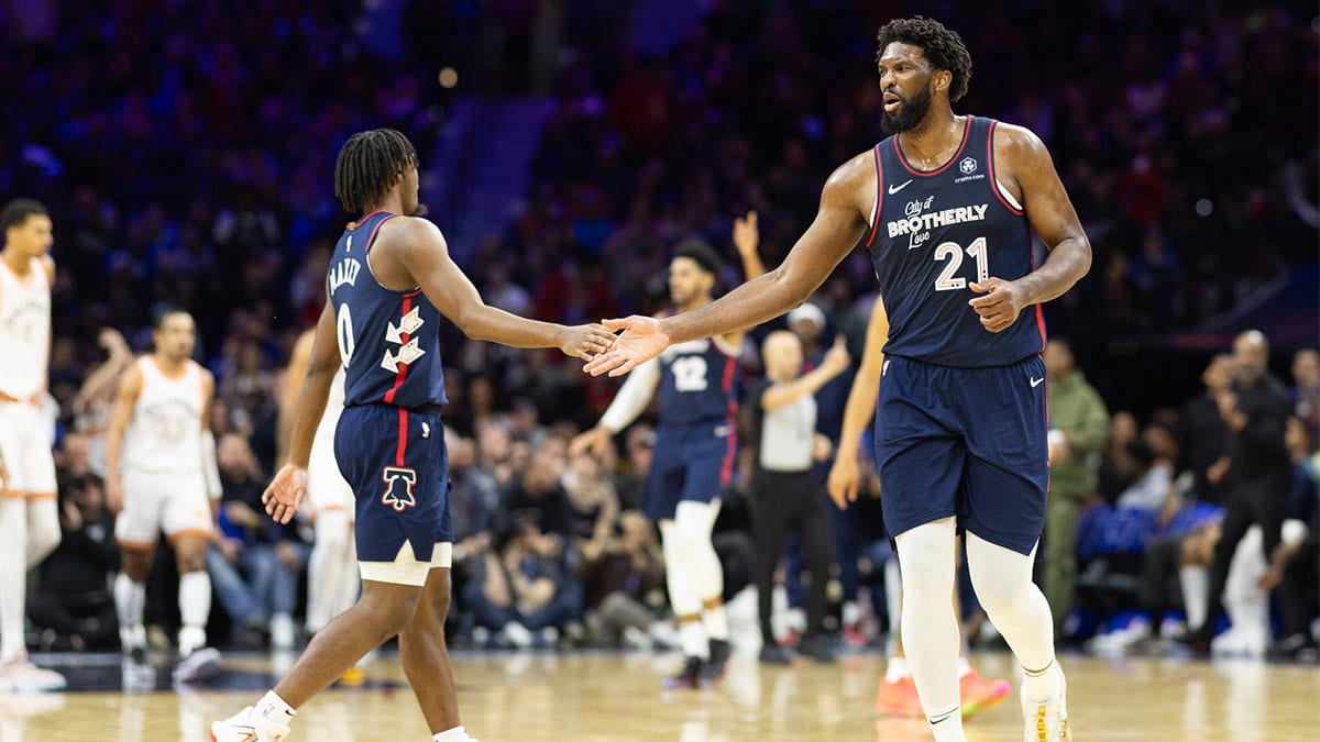 Philadelphia 76ers center Joel Embiid (21) reacts with guard Tyrese Maxey (0) after an assist during the third quarter against the San Antonio Spurs at Wells Fargo Center.