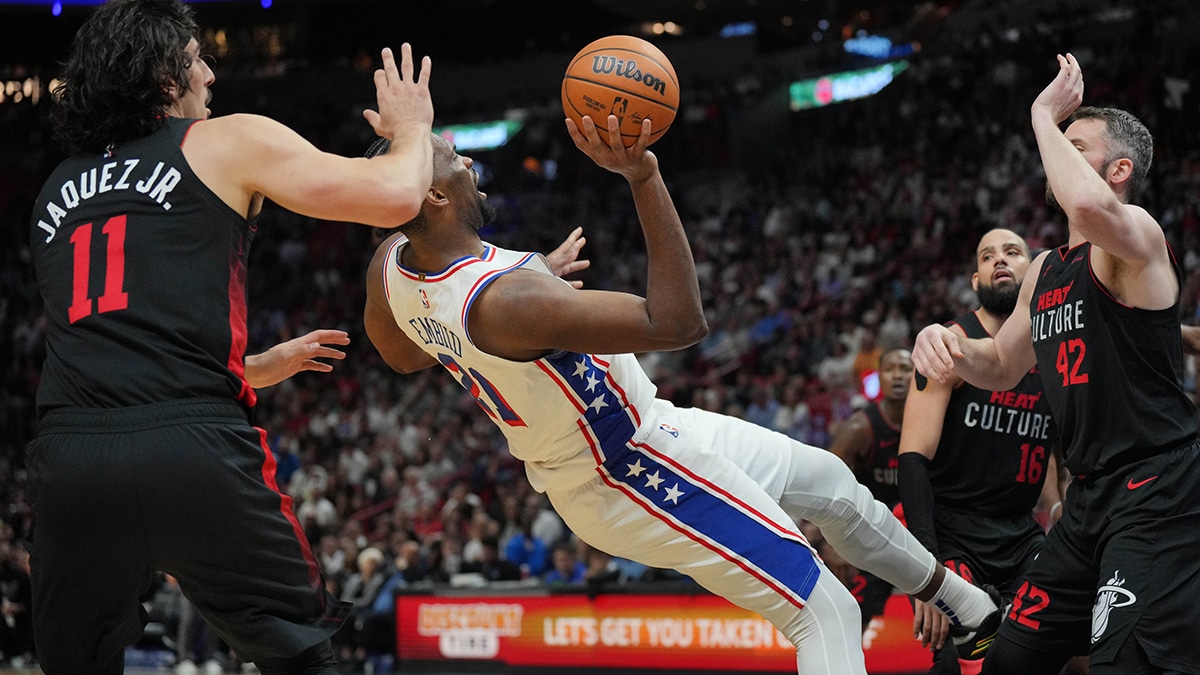 Philadelphia 76ers center Joel Embiid (21) puts up a shot while falling backward against the Miami Heat during the second half at Kaseya Center.