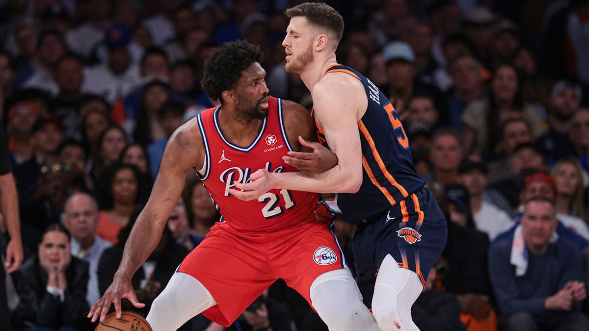 Philadelphia 76ers center Joel Embiid (21) is defended by New York Knicks center Isaiah Hartenstein (55) during the second half during game two of the first round for the 2024 NBA playoffs at Madison Square Garden. 