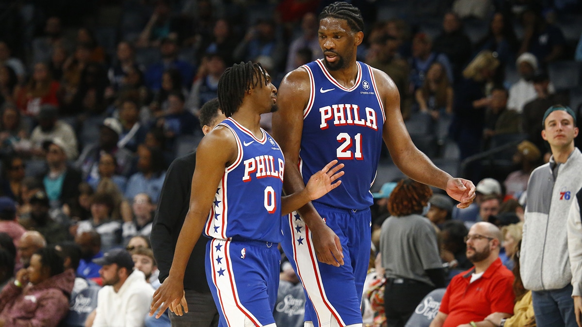 Philadelphia 76ers guard Tyrese Maxey (0) and center Joel Embiid (21) talk as they walk off the court at half time against the Memphis Grizzlies at FedExForum.