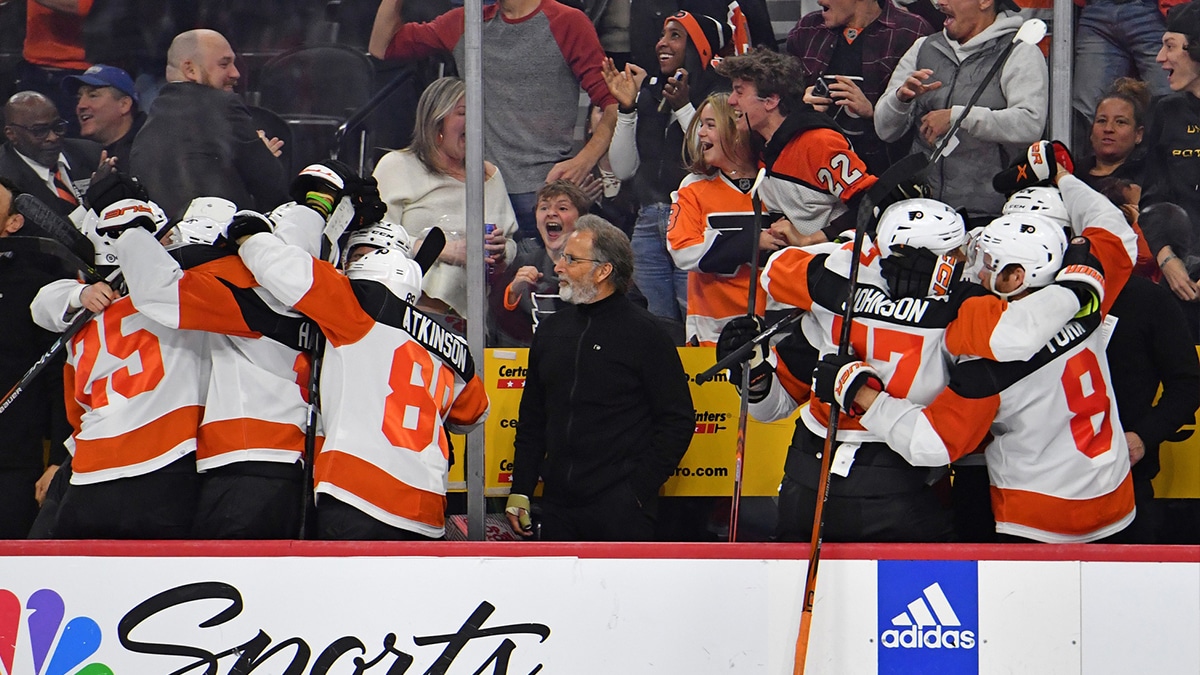 Philadelphia Flyers head coach John Tortorella on the bench as players bench react after a game-tying goal with nine seconds left against the New York Islanders during the third period at Wells Fargo Center.